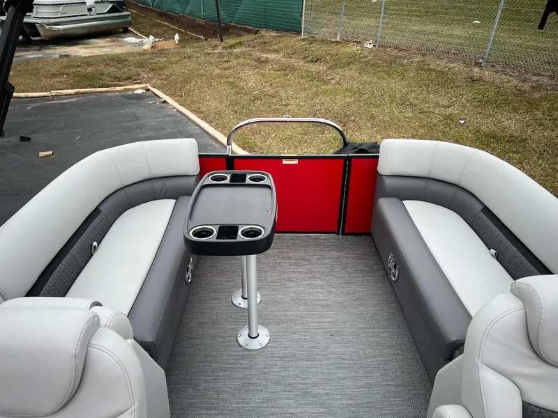 Slide: The Image of 2024 Godfrey SWEETWATER 2286 SB pontoon boat interior with seating and table. - 11