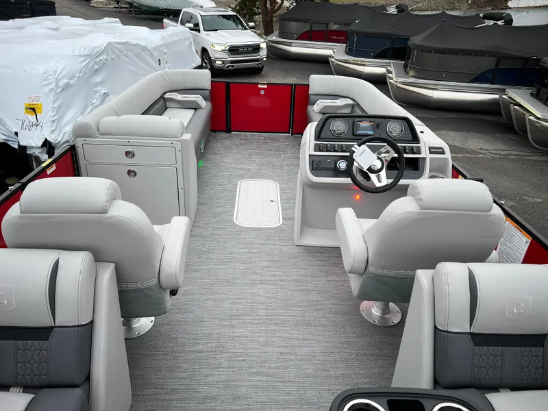 Slide: The Image of 2024 Godfrey SWEETWATER 2286 SB pontoon boat interior with modern seating and control console. - 14