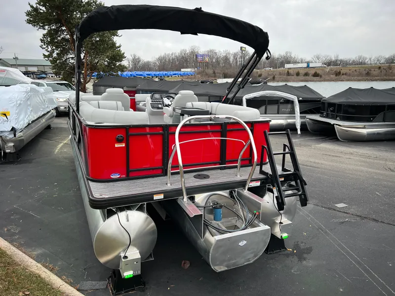 Slide: The Image of 2024 Godfrey SWEETWATER 2286 SB pontoon boat with red exterior and black canopy. - 6