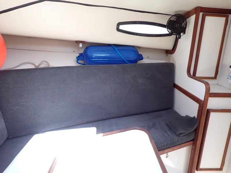 Slide: The Image of Interior of 1989 Blackfin 29 Combi boat with cushioned seating and storage. - 11