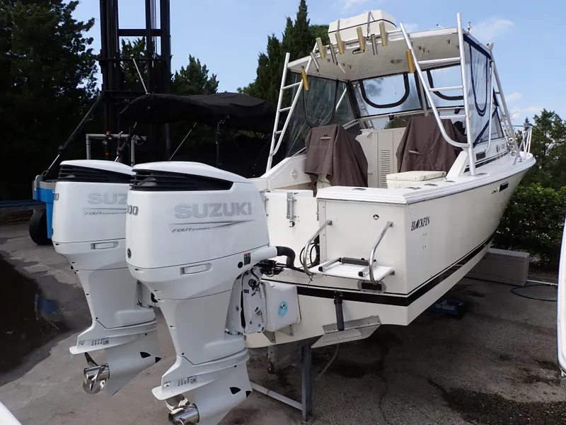Slide: The Image of 1989 Blackfin 29 Combi boat with twin Suzuki outboard engines. - 2