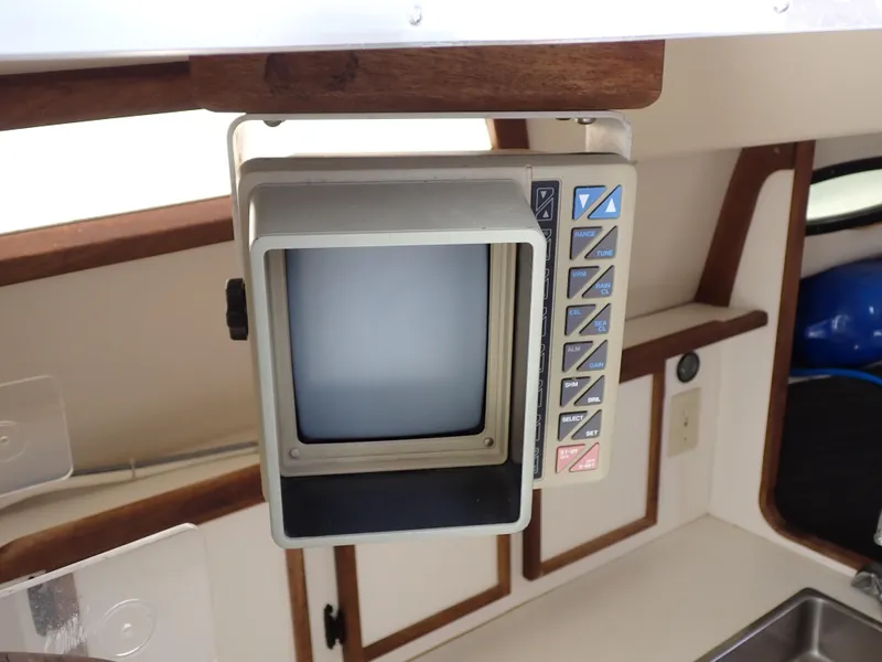 Slide: The Image of 1989 Blackfin 29 Combi boat interior with vintage electronic display. - 23