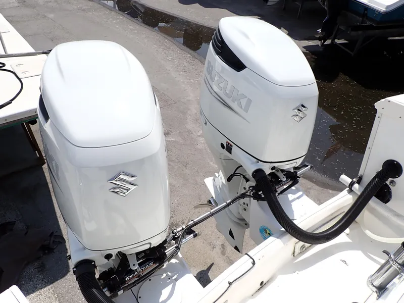 Slide: The Image of Twin Suzuki outboard engines on a 1989 Blackfin 29 Combi boat. - 24