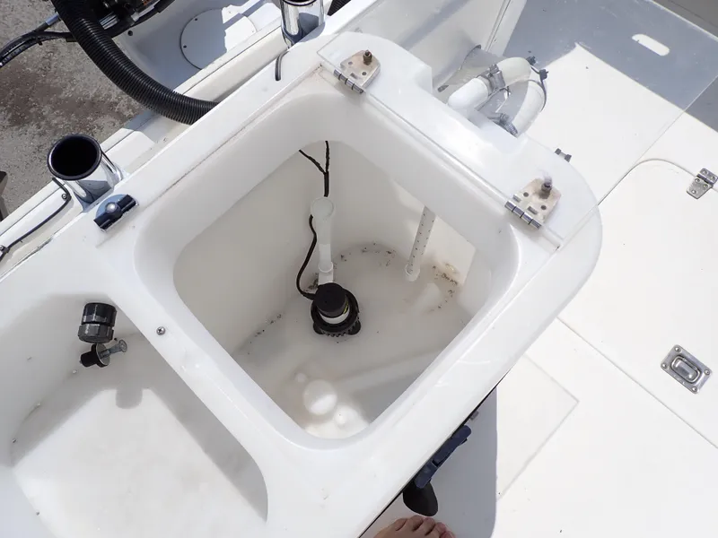 Slide: The Image of 1989 Blackfin 29 Combi boat livewell with plumbing and fittings. - 27