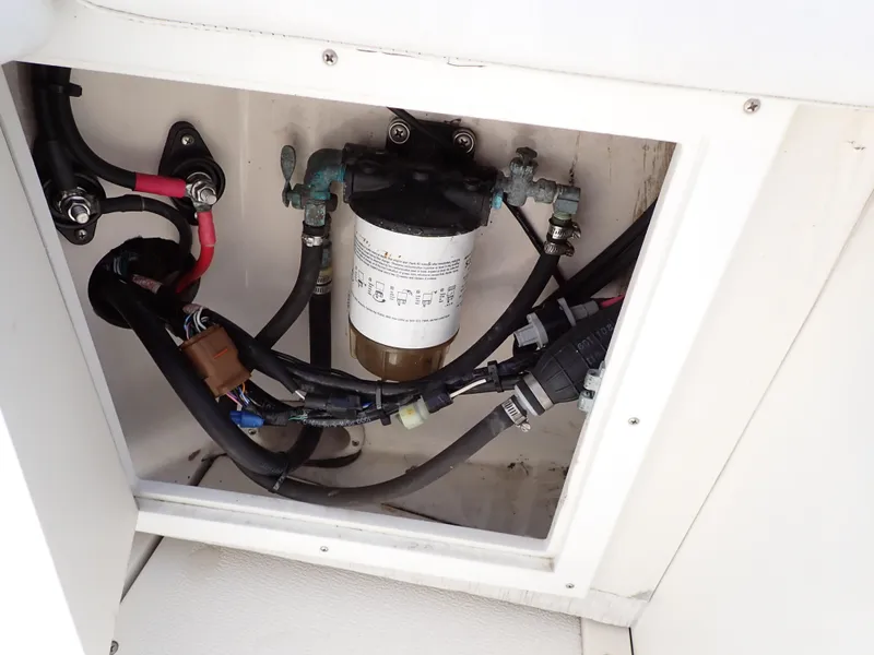 Slide: The Image of 1989 Blackfin 29 Combi engine compartment with fuel filter and wiring. - 32