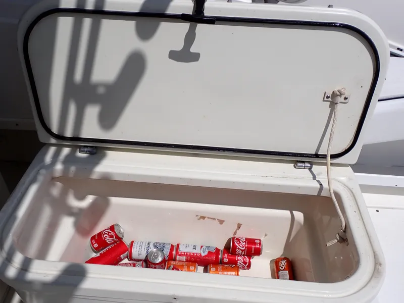 Slide: The Image of Open cooler on 1989 Blackfin 29 Combi boat with soda cans inside. - 39