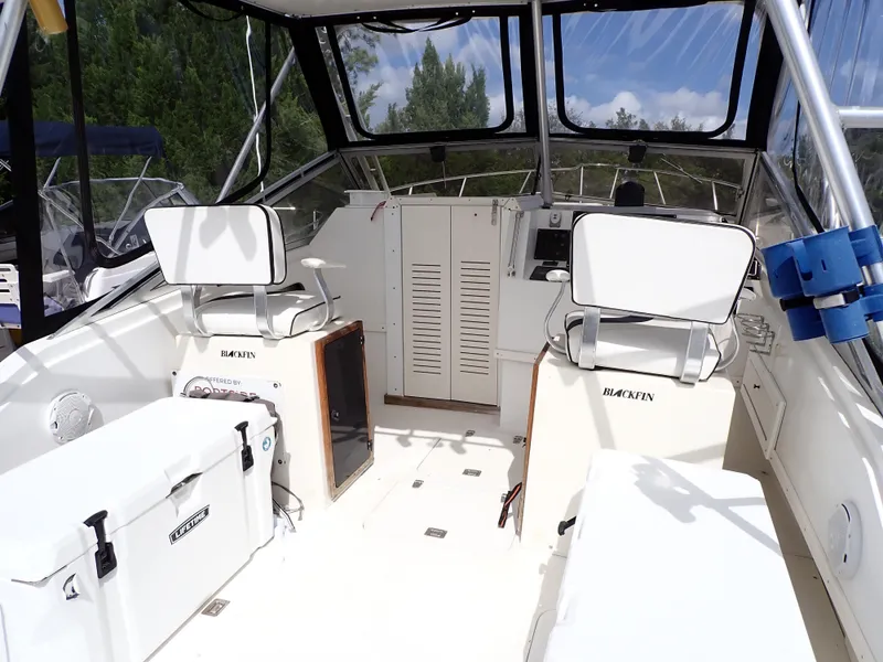 Slide: The Image of 1989 Blackfin 29 Combi boat interior with seating and storage compartments. - 5