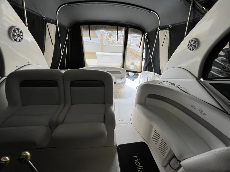 Slide: The Image of 2007 Sea Ray 320 Sundancer repowered interior with seating and covered deck. - 10