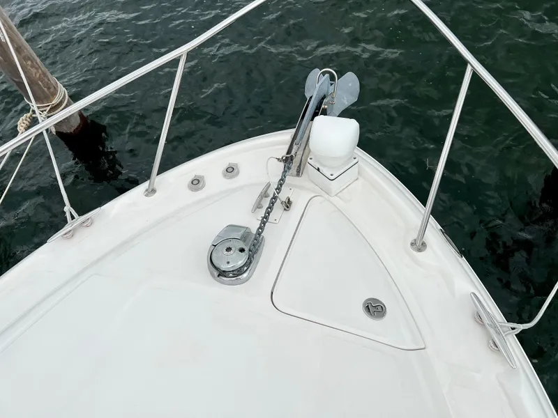 Slide: The Image of Bow of 2007 Sea Ray 320 Sundancer repowered, featuring anchor and railing. - 16