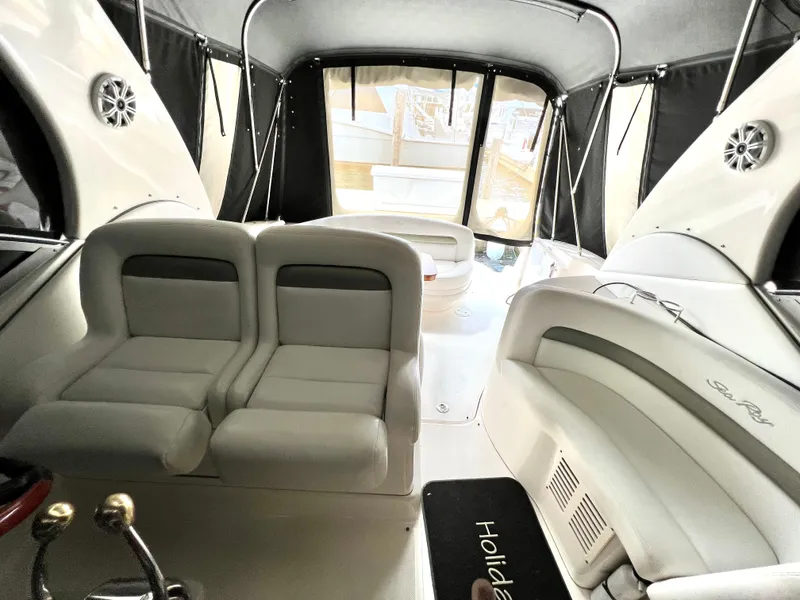 Slide: The Image of Interior of 2007 Sea Ray 320 Sundancer repowered, featuring seating and helm area. - 17