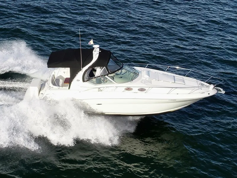Slide: The Image of 2007 Sea Ray 320 Sundancer repowered cruising on open water. - 3