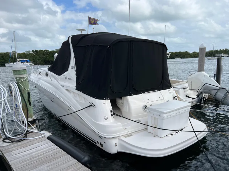 Slide: The Image of 2007 Sea Ray 320 Sundancer repowered yacht docked with black canvas cover. - 37