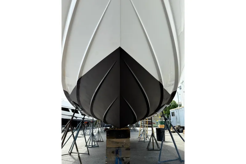 Slide: The Image of 2007 Sea Ray Sundancer 320 boat hull on stands, showcasing sleek design and craftsmanship. - 38