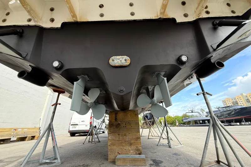 Slide: The Image of 2007 Sea Ray Sundancer 320 boat hull and propellers on dry dock for maintenance. - 39