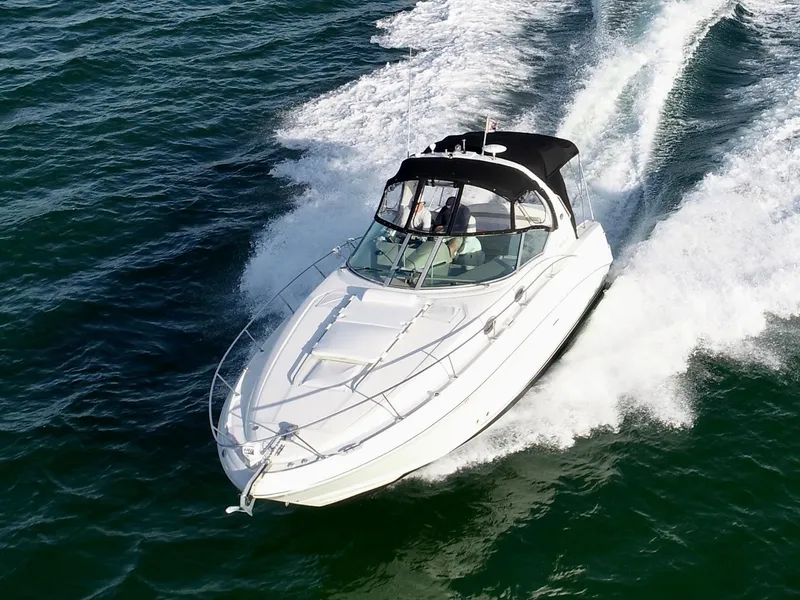Slide: The Image of 2007 Sea Ray 320 Sundancer repowered cruising on open water. - 4