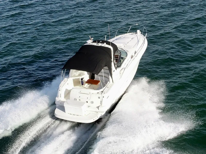 Slide: The Image of 2007 Sea Ray 320 Sundancer repowered cruising on open water. - 5