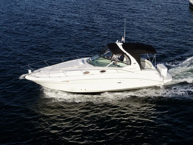 Slide: The Image of 2007 Sea Ray 320 Sundancer repowered cruising on open water. - 6