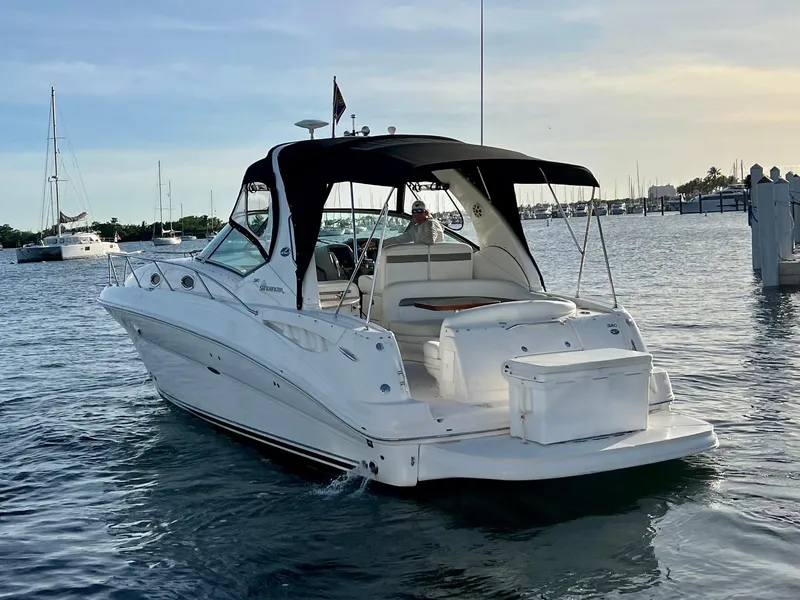 Slide: The Image of 2007 Sea Ray 320 Sundancer repowered cruising in a marina. - 7