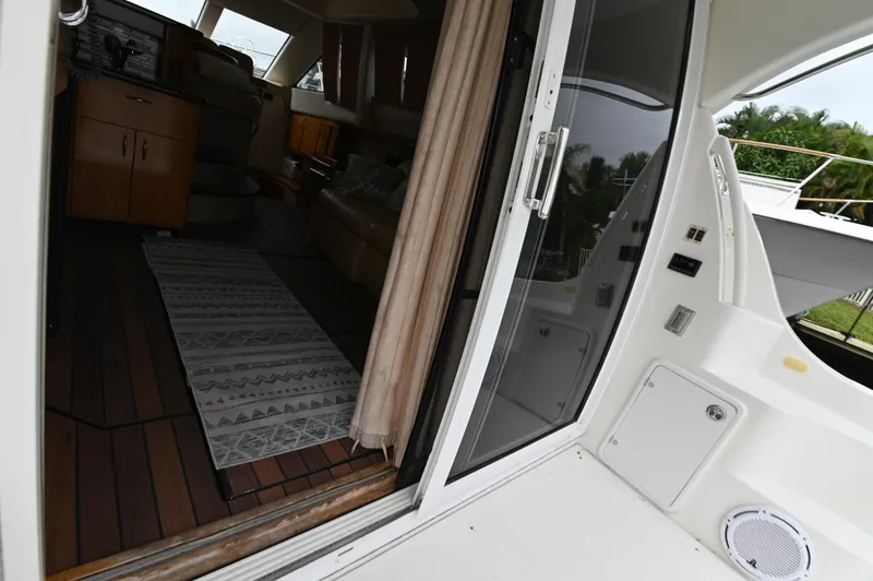 Slide: The Image of Interior view of a 2005 Carver 36 Super Sport yacht, showing the living area. - 33