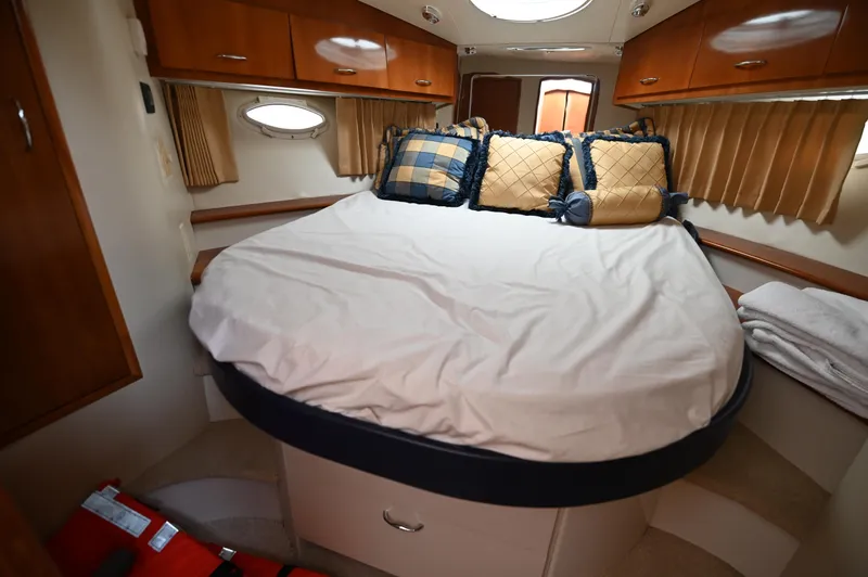 Slide: The Image of Interior cabin of 2005 Carver 36 Super Sport yacht with bed and storage. - 36