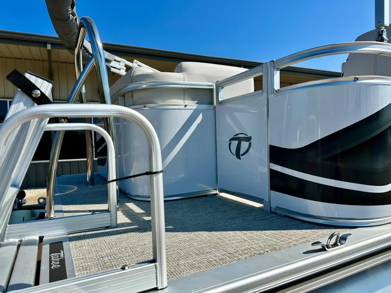 Slide: The Image of 2023 Tahoe Pontoon 19FT STX Cruise boat with sleek design and modern features. - 2