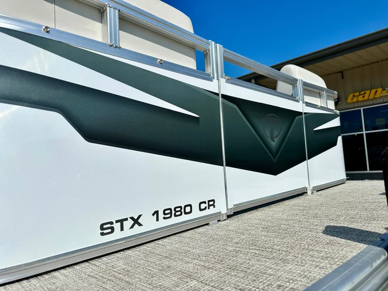 Slide: The Image of 2023 Tahoe Pontoon 19FT STX Cruise boat side view with STX 1980 CR branding. - 3