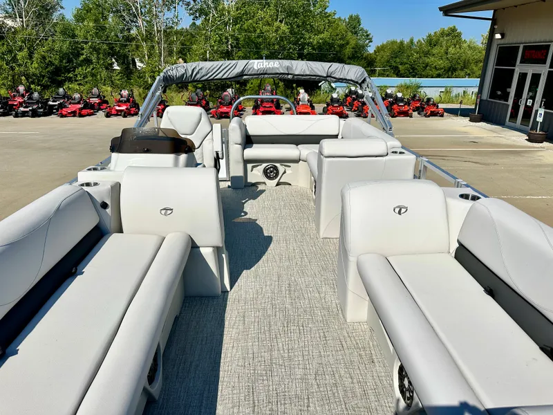 Slide: The Image of 2023 Tahoe Pontoon 19FT STX Cruise with spacious seating and modern design. - 4