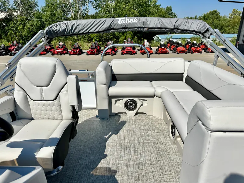 Slide: The Image of 2023 Tahoe Pontoon 19FT STX Cruise interior with plush seating and modern design. - 7