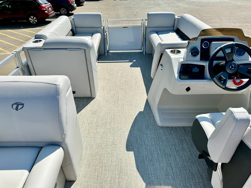 Slide: The Image of 2023 Tahoe Pontoon 19FT STX Cruise interior with plush seating and modern helm. - 8