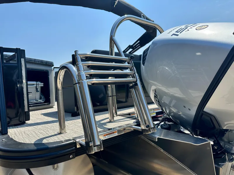 Slide: The Image of 2023 Tahoe Pontoon LTZ Cruise 23FT with stainless steel ladder and outboard motor. - 10