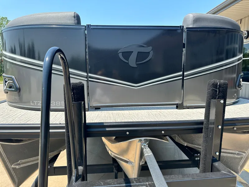 Slide: The Image of 2023 Tahoe Pontoon LTZ Cruise 23FT front view on trailer. - 11