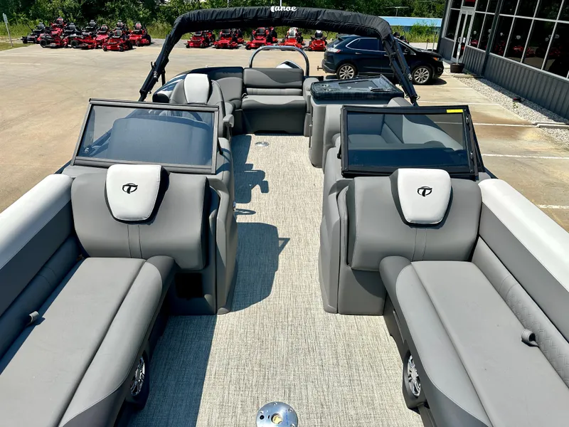 Slide: The Image of 2023 Tahoe Pontoon LTZ Cruise 23FT interior with gray seating and spacious layout. - 2