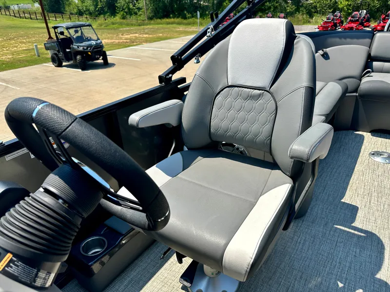 Slide: The Image of 2023 Tahoe Pontoon LTZ Cruise 23FT captain's chair and steering wheel. - 3