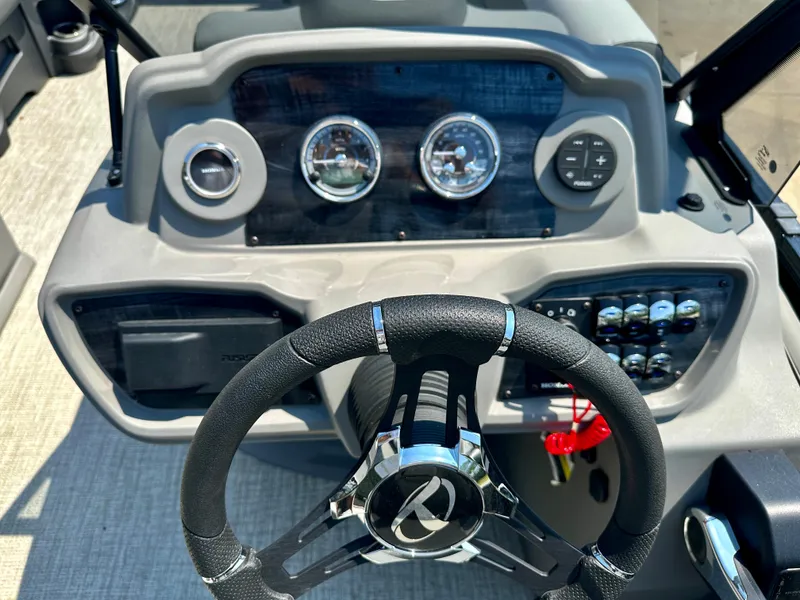 Slide: The Image of 2023 Tahoe Pontoon LTZ Cruise 23FT dashboard and steering wheel. - 4