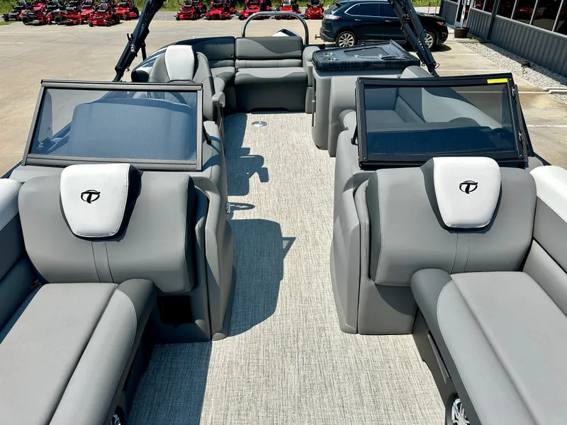 Slide: The Image of 2023 Tahoe Pontoon LTZ Cruise 23FT interior with gray seating and windshields. - 6