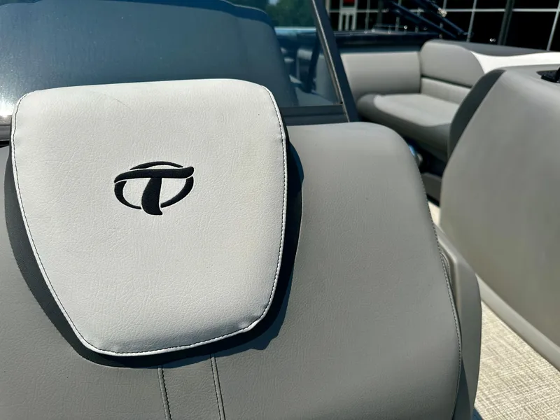 Slide: The Image of 2023 Tahoe Pontoon LTZ Cruise 23FT interior, featuring grey seating and logo. - 7