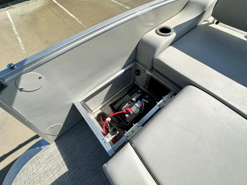 Slide: The Image of 2023 Tahoe Pontoon 23FT Cascade Versatile Rear Bench with open battery compartment. - 11