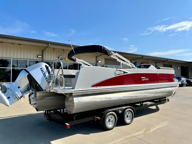 Slide: The Image of 2023 Tahoe Pontoon 23FT Cascade Versatile Rear Bench on trailer, side view. - 3