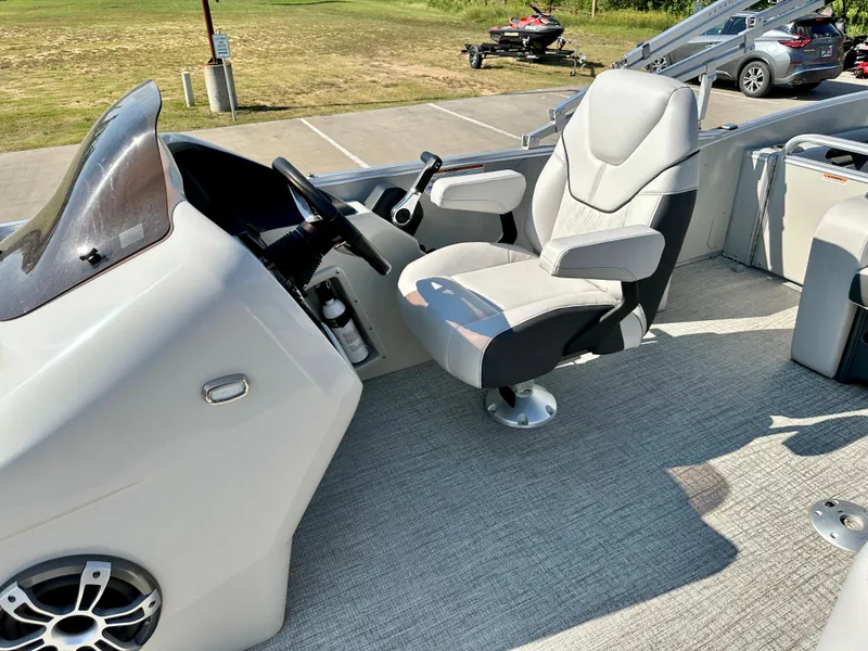 Slide: The Image of 2023 Tahoe Pontoon 23FT Cascade Versatile Rear Bench captain's chair and helm station. - 6