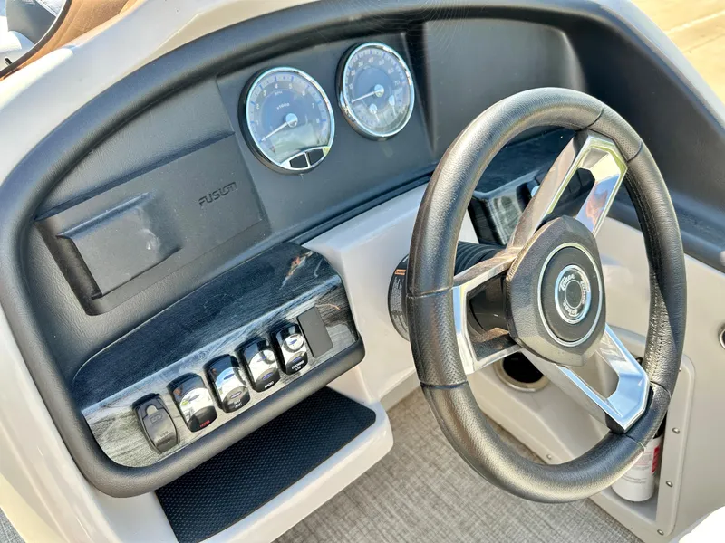 Slide: The Image of 2023 Tahoe Pontoon 23FT Cascade Versatile Rear Bench dashboard and steering wheel. - 8