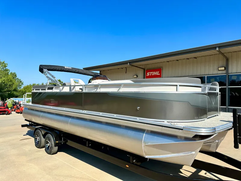 Slide: The Image of 2023 Tahoe Pontoon 25 FT LTZ Quad Lounger on trailer outside dealership. - 2