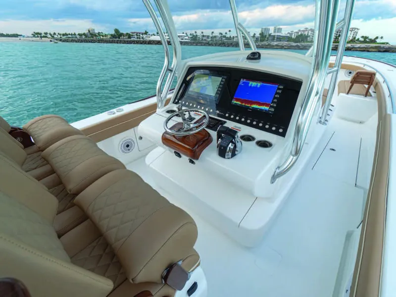 Slide: The Image of 2025 Valhalla Boatworks V-37 helm station with advanced navigation system and luxurious seating. - 16