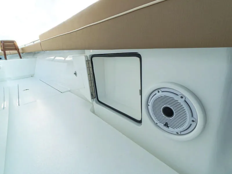 Slide: The Image of 2025 Valhalla Boatworks V-37 interior, featuring storage compartment and speaker. - 22