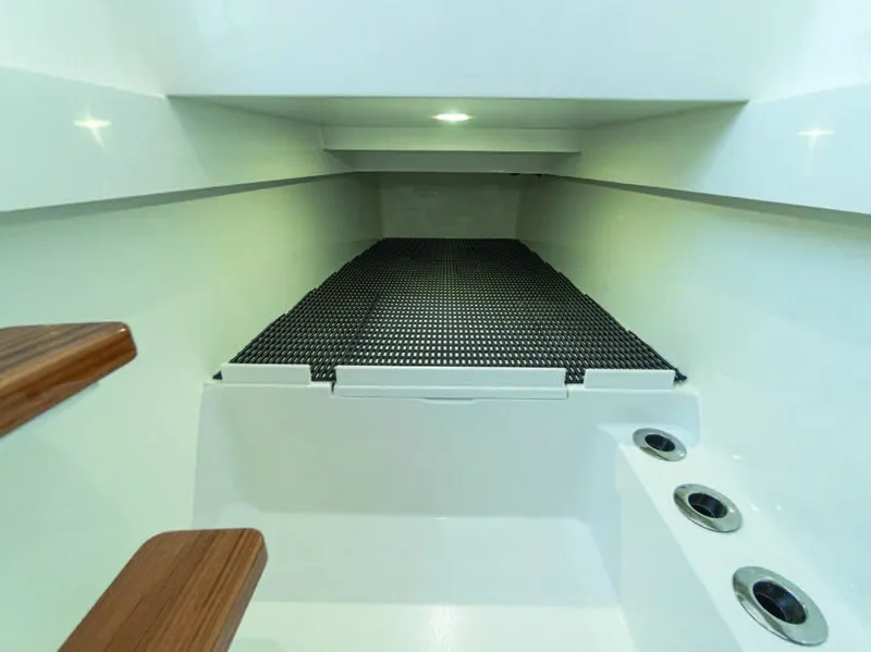 Slide: The Image of 2025 Valhalla Boatworks V-37 interior cabin with wooden steps and modern design. - 29