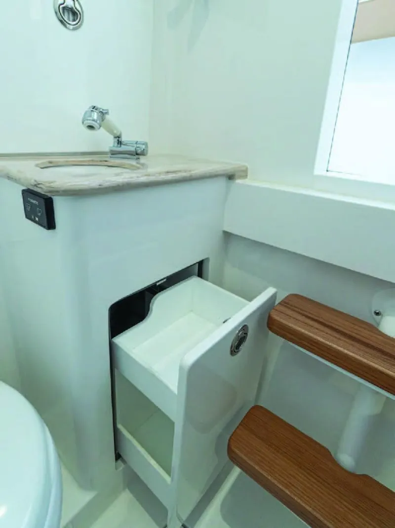 Slide: The Image of 2025 Valhalla Boatworks V-37 interior with sink, drawer, and wooden steps. - 32