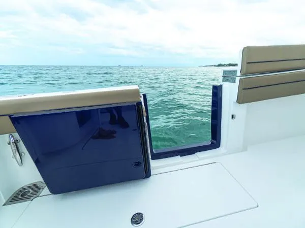 Slide: The Image of Valhalla Boatworks V-41 2025 model with open side door, ocean view. - 36