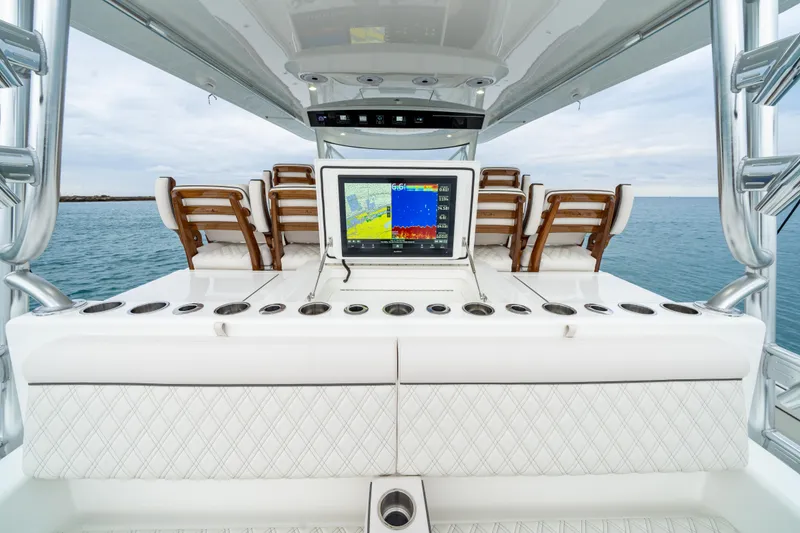 Slide: The Image of 2025 Valhalla Boatworks V-55 helm station with advanced navigation system and luxurious seating. - 12