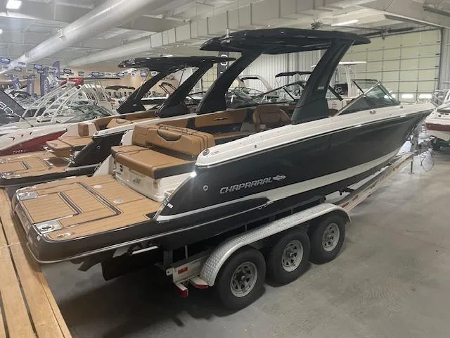 The Image of 2025 Chaparral 307 SSX boat on trailer in showroom. - 0