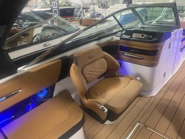 Slide: The Image of Luxurious interior of 2025 Chaparral 307 SSX boat with tan leather seating. - 13