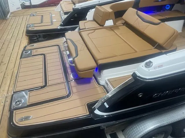 Slide: The Image of 2025 Chaparral 307 SSX boat with tan seating and sleek design. - 7